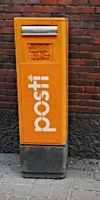 Orange post box in Helsinki, Finland